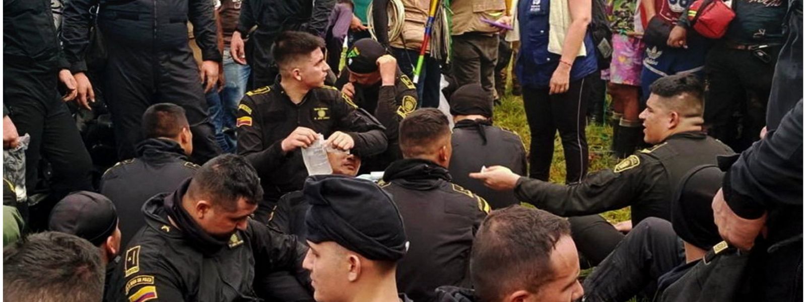 Seventy-nine Colombian police officers taken hostage by area residents demanding help to build roads for their town, freed peacefully